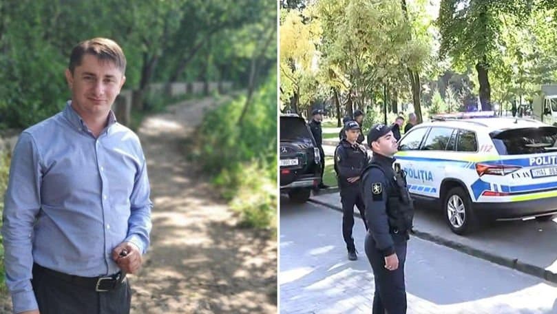 Mașină de poliție parcată lângă un spațiu public din centrul unui oraș